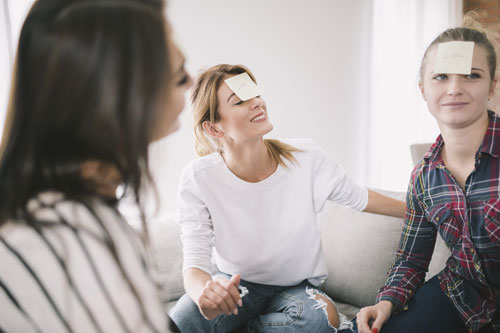 people-playing-interesting-game-with-guessing-names